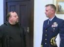 Keith Mutch, KB1RBI (left), chats with a US Coast Guard officer prior to a recognition ceremony May 20 at New London, Connecticut, City Hall. [Fox News-CT video]